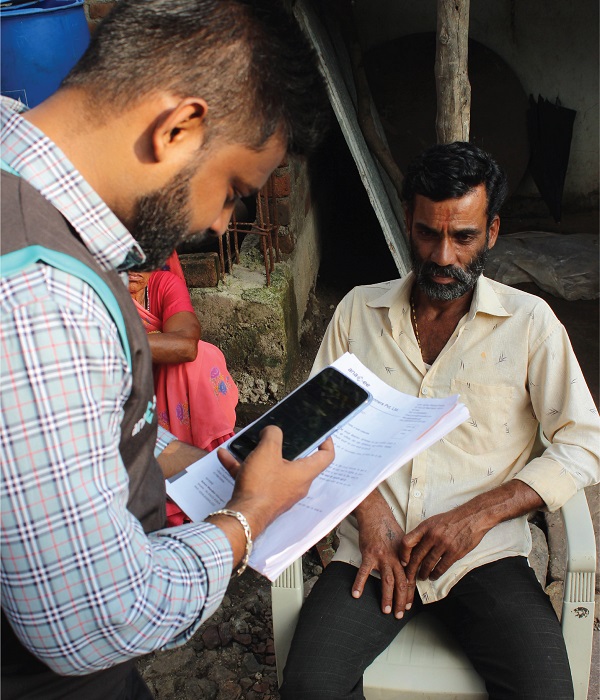 Anaxee Field Employees Taking Data from Potential Lead In Rural India
