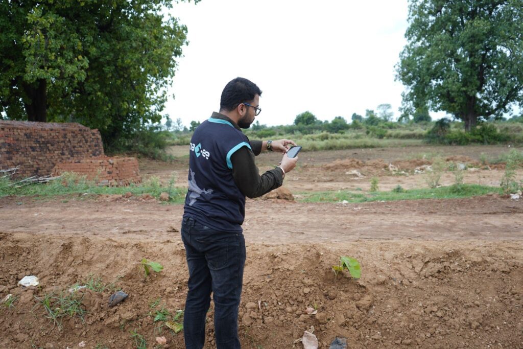 Field worker Geo Tagging the trees in Agroforestry Project 